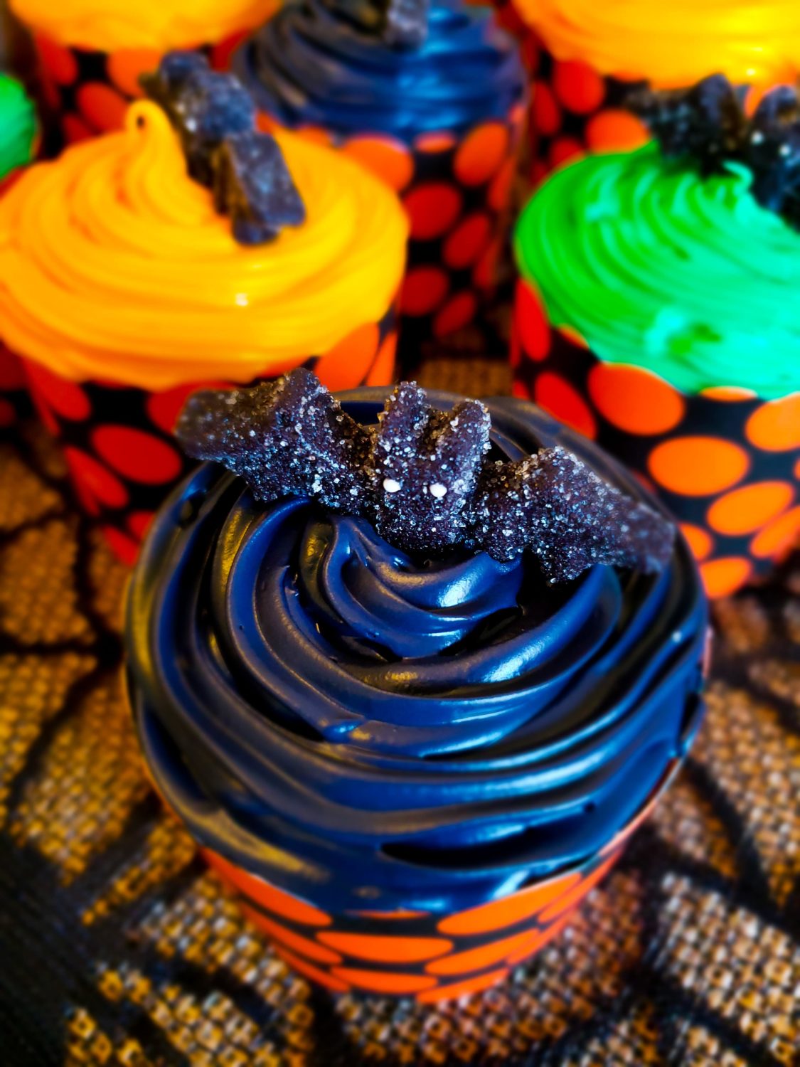cupcakes topped with bat gummies