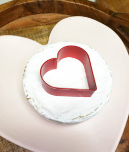 heart cookie cutter on brie