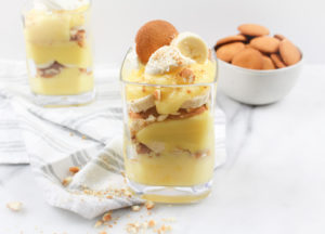 Banana Pudding in a glass dish layered with nilla wafers and banana slices