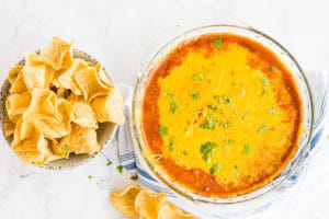 Easy Chili Dip in a bowl with chips on the side