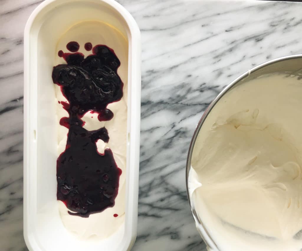 the blueberry compote (jam) is spread on top of the cream 