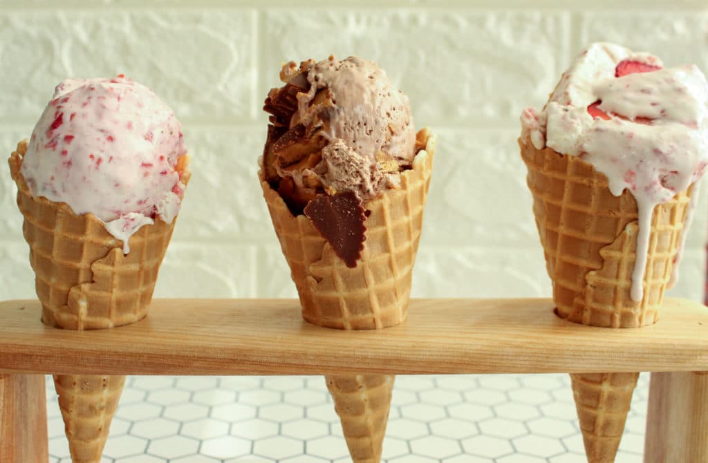 three ice cream cones in a cone holder
