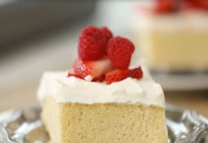Tres Leche Cake topped with strawberries