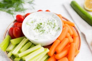 Tzatziki Dip in a dish surrounded by veggies