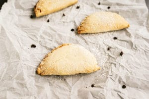 Sweet Ricotta Hand Pies on parchment paper