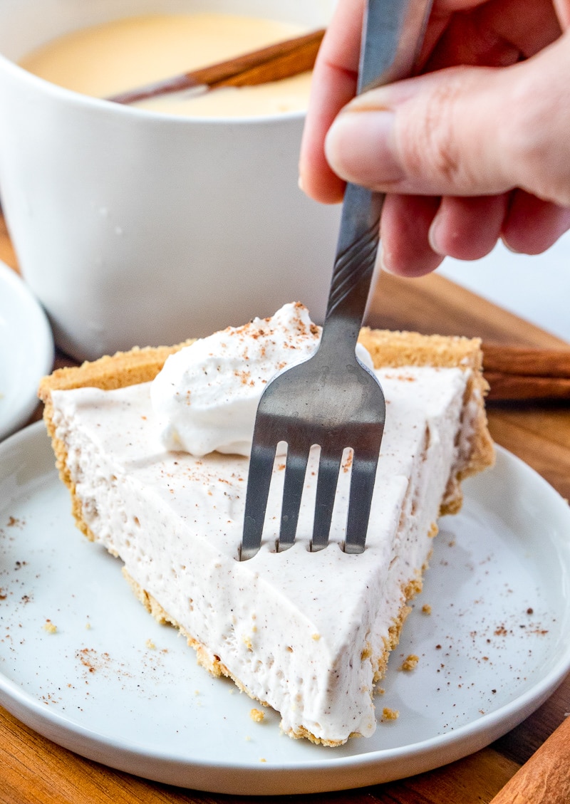 a fork stuck in to a piece of no bake eggnog pie