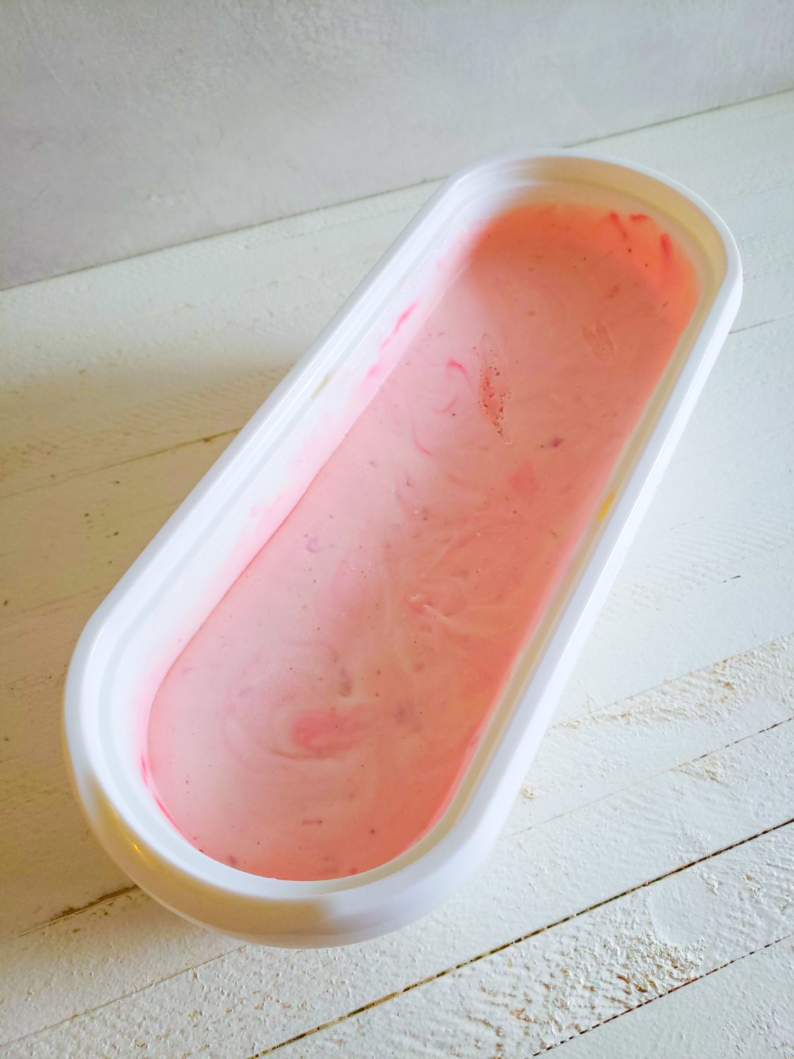 a dish of strawberry ice cream
