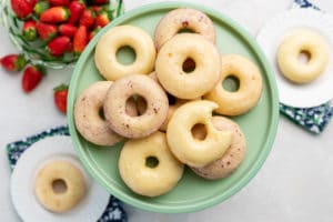 a plate of homemade Vanilla Buttermilk Donuts with Fruity Glazes