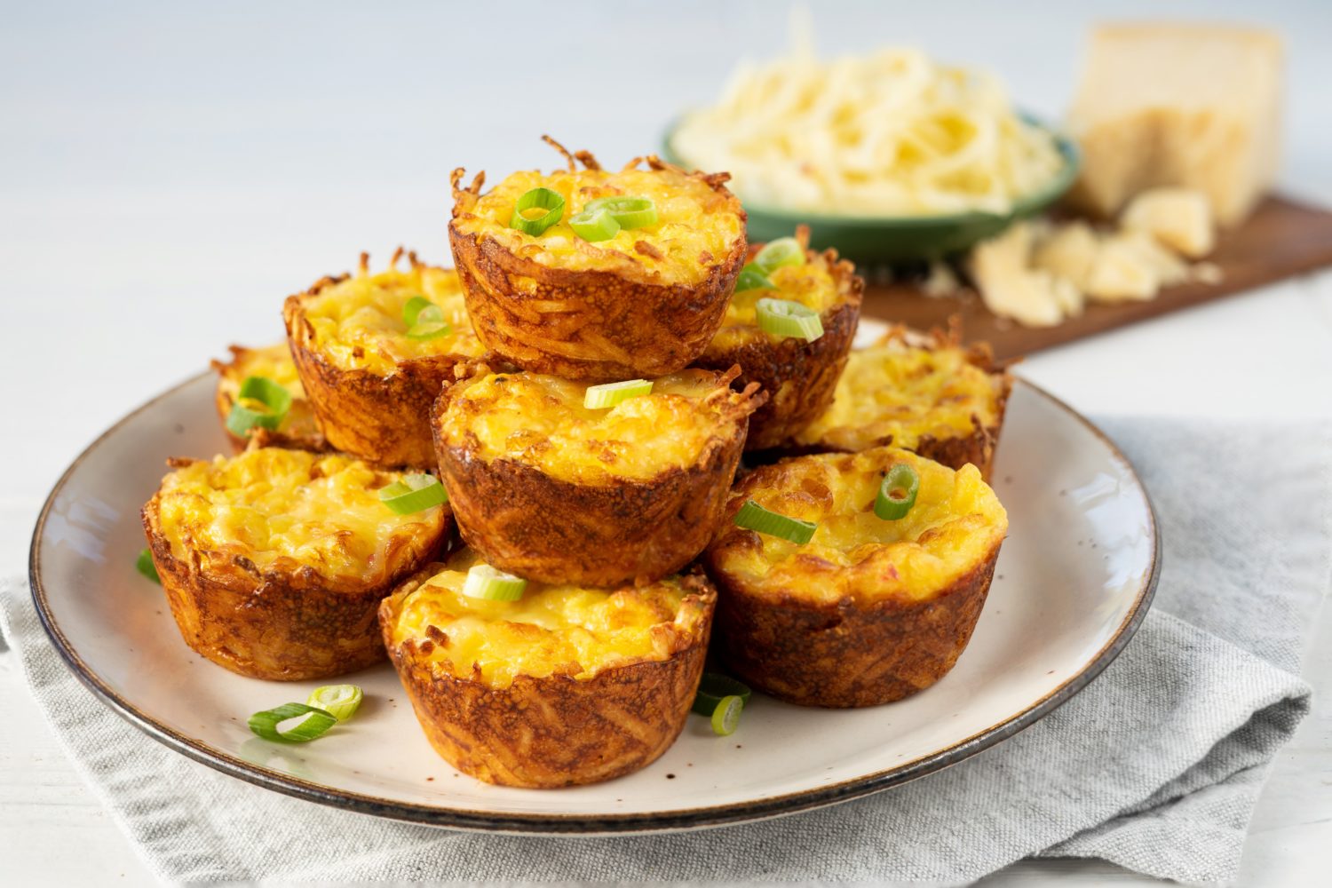 a pile of egg and hash brown muffins