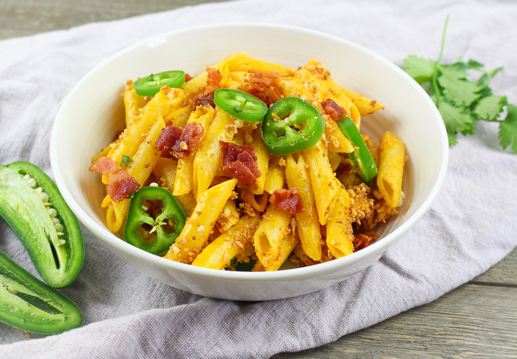penne noodles with bacon and jalapenos on top