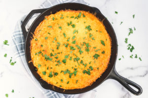 cast iron skillet of eggs and cheese