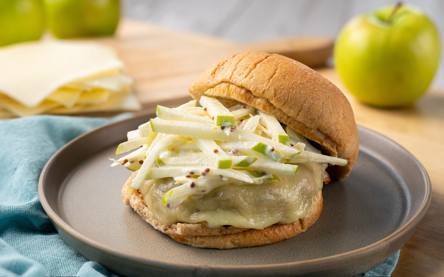 turkey cheddar burger with apple slaw is pictured