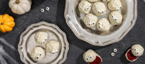 Bite-sized delicious red velvet cheesecake mummy truffles with a spooky twist.